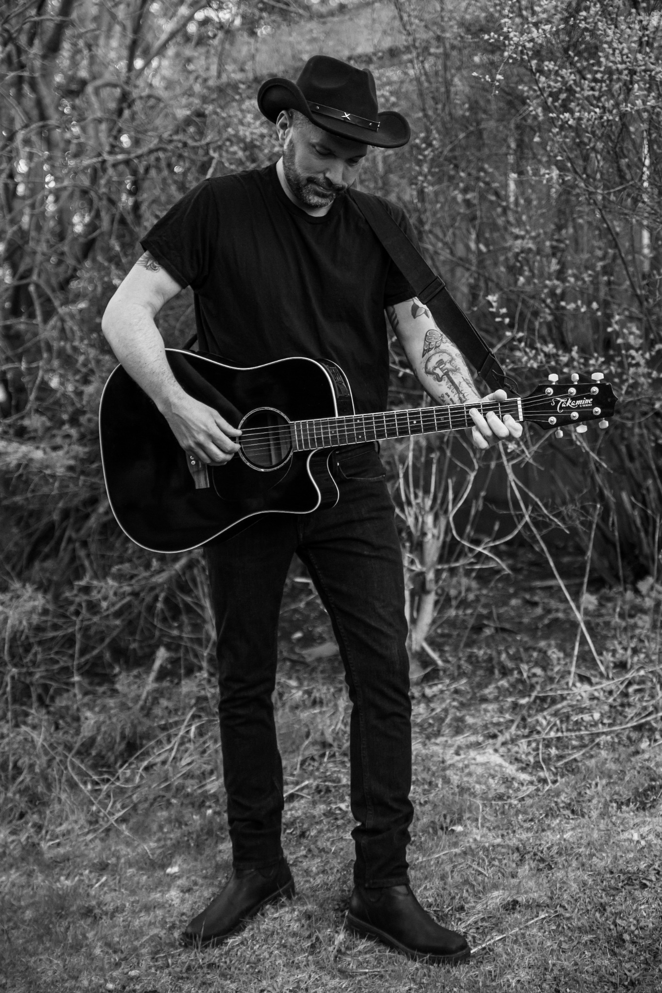 Black-and-white acoustic guitar portrait