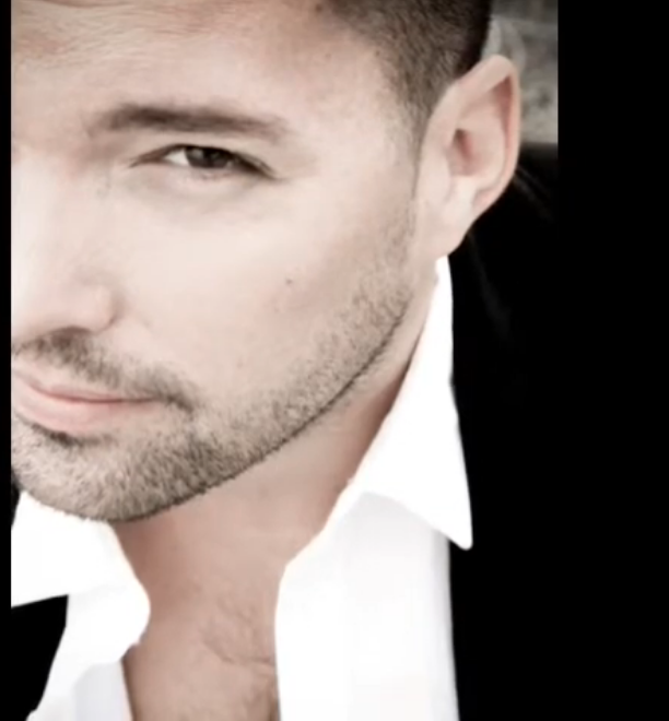 Archival close-up portrait in black jacket and white shirt