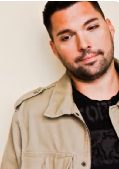 Archival promotional portrait in a beige jacket